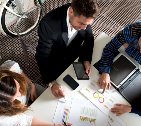 Aerial view of people working together around a table